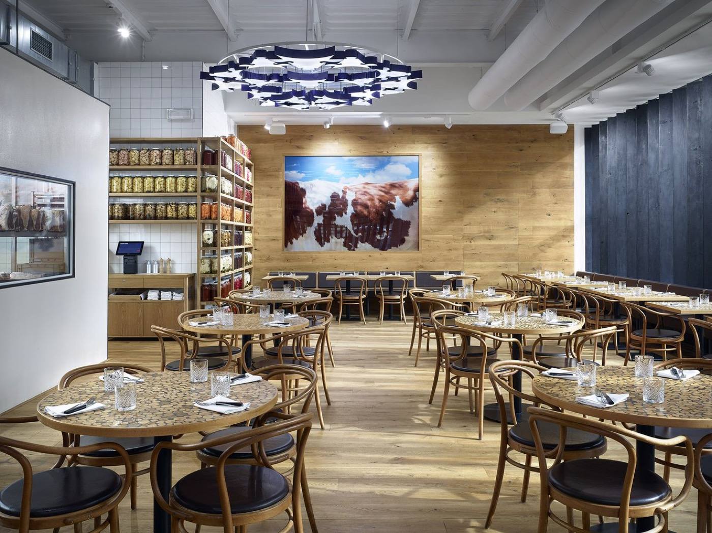 Interior of Čestr restaurant with wooden furniture and an open dining space