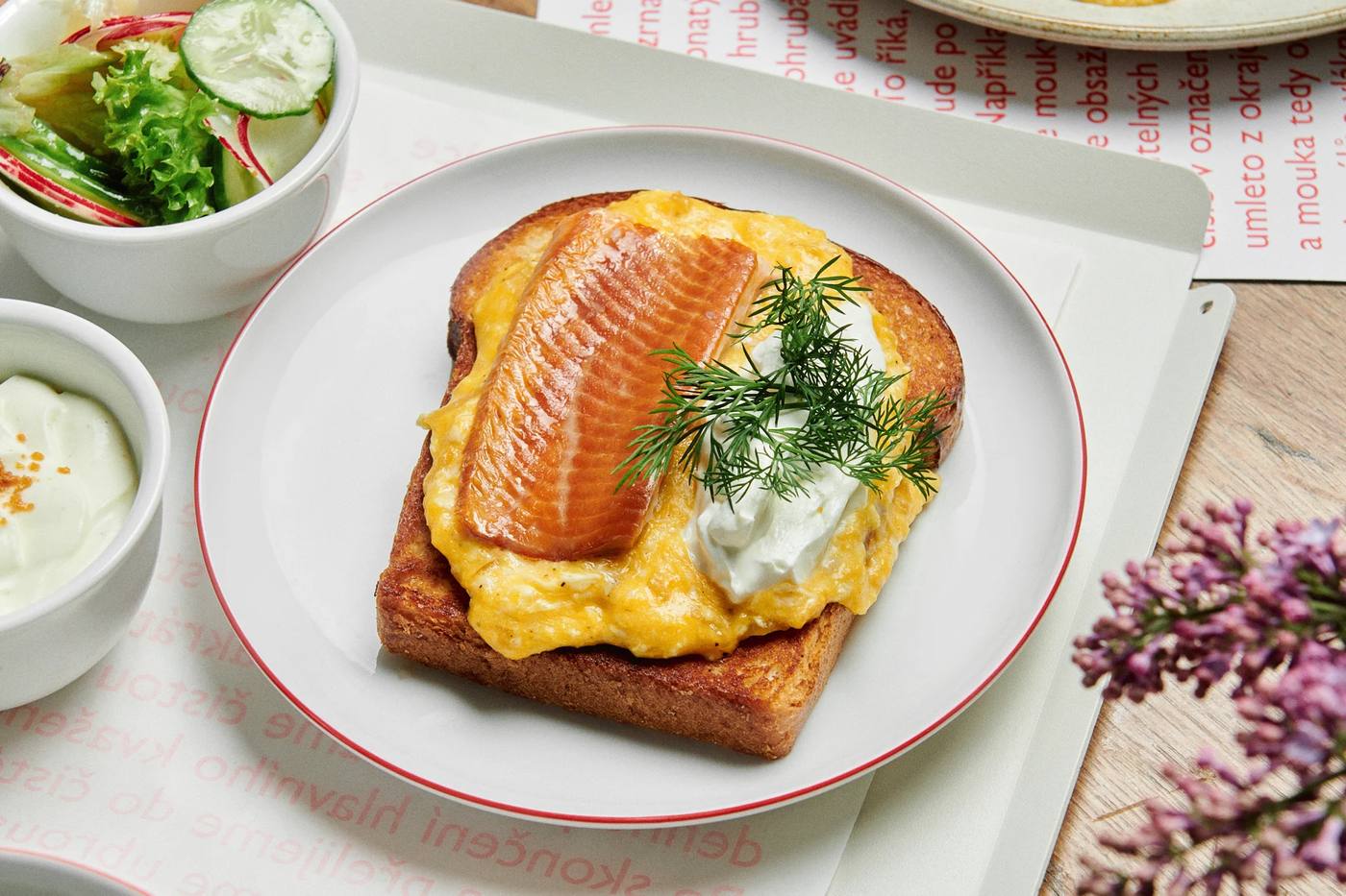 Sourdough toast with scrambled eggs, smoked fish and dill