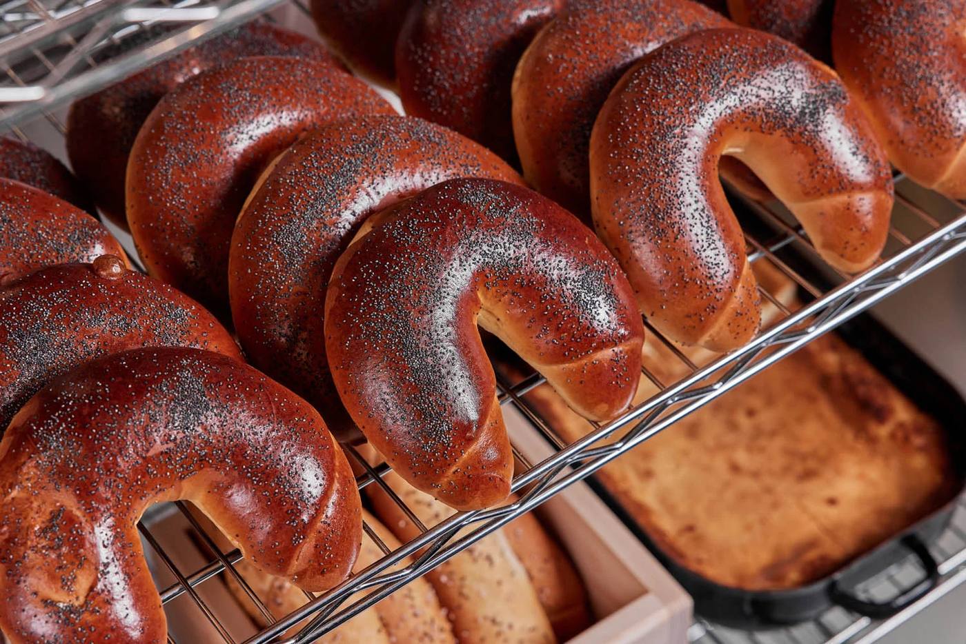 Poppy-seed rolls on a rack at the Eska bakery