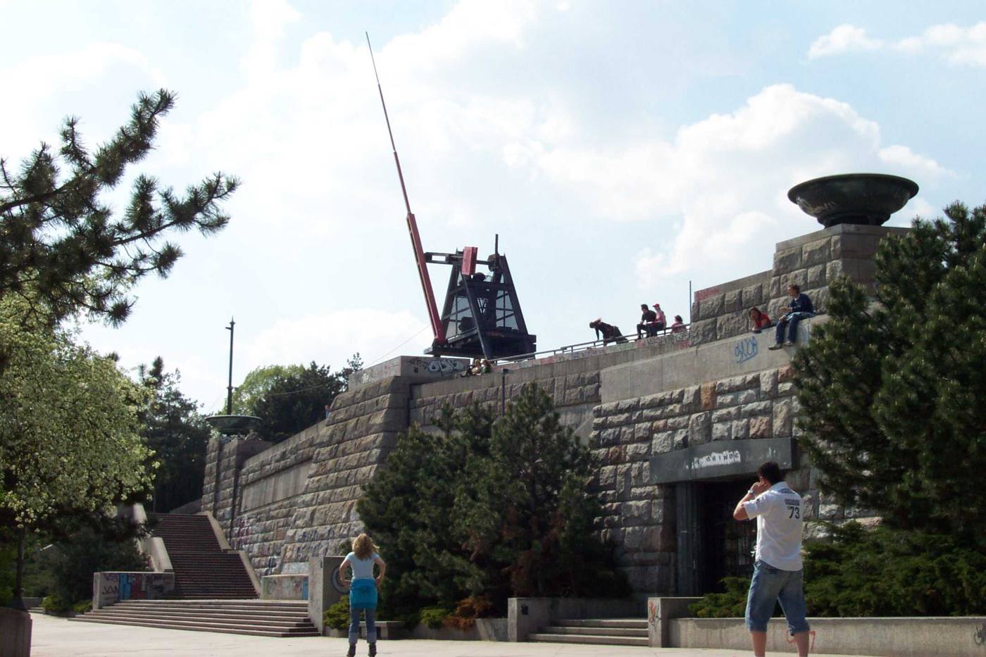 The giant red Metronome on its stone plinth above the steps in Letná park