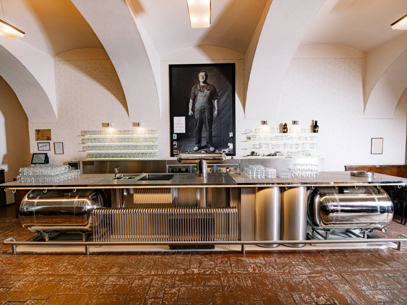 Stainless-steel bar under white vaults at Lokál Dlouhááá