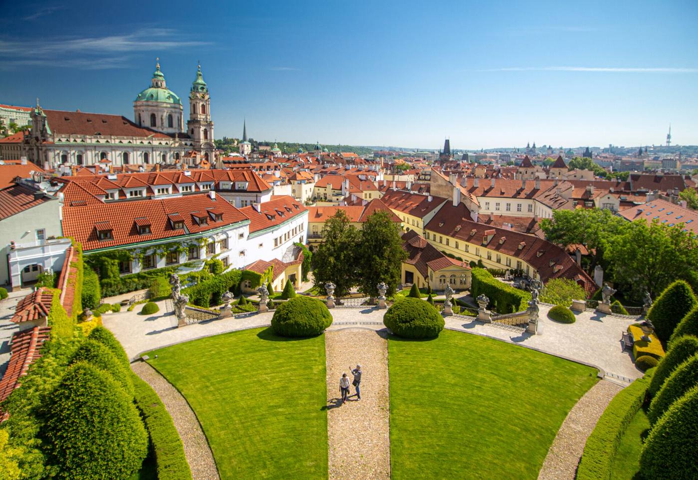 View down over the terraced lawns and statues of Vrtba Garden to the rooftops of Malá Strana